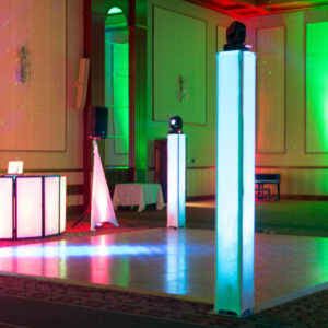 A dance floor set up with green and red lights.