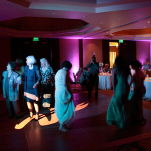 A group of people dancing on a dance floor.
