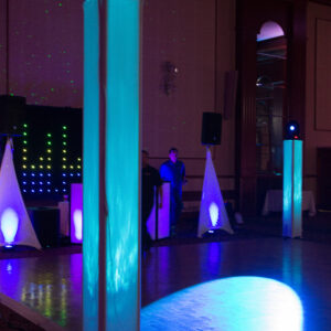 A dance floor with blue and purple lights.