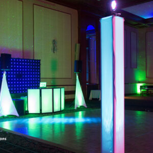 A stage with lights, a column, and a wedding DJ.