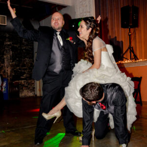 A man in a black suit and a woman in a black dress.