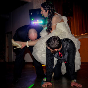 A man in a wedding dress and a woman in a wedding dress.