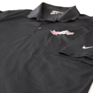 An apparel item - a black Nike Dri-Fit polo shirt with a pink logo.