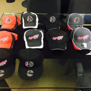 An assortment of hats displayed on a table.