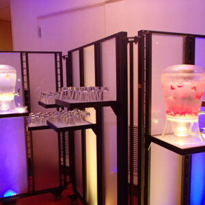 A display of drinks on a table in a room.