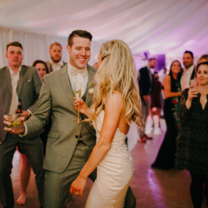 A bride and groom dancing at their wedding reception with a Denver DJ setting the vibe.
