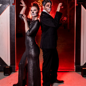 A man and a woman dressed up for Halloween, ready for the photo booth rental.