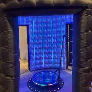 An inflatable room with a blue light in it, perfect for a bat mitzvah.