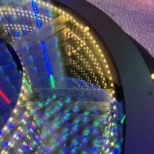 A circular table with colorful lights on it, perfect for a bat mitzvah with Denver DJ service.