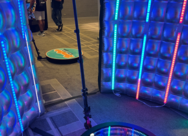 A room with colorful lights and a chair in it, perfect for a bar mitzvah photo booth rental.