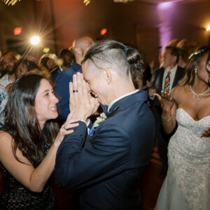 A bride and groom dancing at a wedding reception with music from a top-notch wedding DJ.