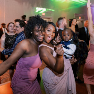 A group of people dancing at a Denver DJ's set during a wedding reception.