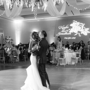 A bride and groom sharing their first dance at a wedding reception, as the Denver DJ plays their favorite song.