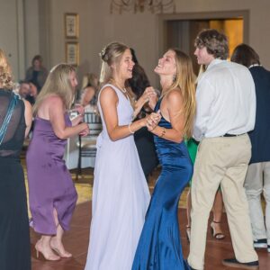 A group of people dancing at a bar mitzvah reception.