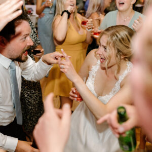 A bride and groom dancing at a wedding reception, enhanced by the tunes of a Denver DJ.