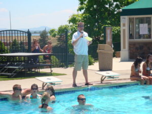 A group of people in a swimming pool at a bar mitzvah.