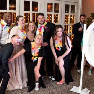 A group of people posing for a photo at a bar mitzvah party.