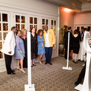 A group of people posing for a photo at a bat mitzvah.