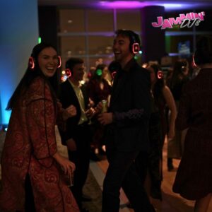 A group of people wearing headphones at a DJ service party.