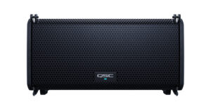 A black QSC audio speaker with a metal grille front, featuring a small logo at the bottom center—ideal for DJ equipment setups.