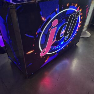 Arcade machine with "jdj" logo featuring neon colors and abstract design.