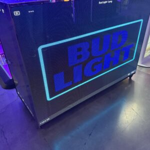 A digital display showing the Bud Light logo in blue text at an event.